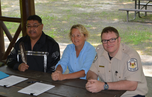 Chief Roland Monague of Beausoleil First Nation, Sandy White and Scott Thomas of the Ministry of Natural Resources & Forestry signed a formal agreement that outlines the partnership in a signing ceremony at Springwater Park on July 3, 2015. The Beausoleil First Nation Council and employees of the new partnership were on hand to witness the event.