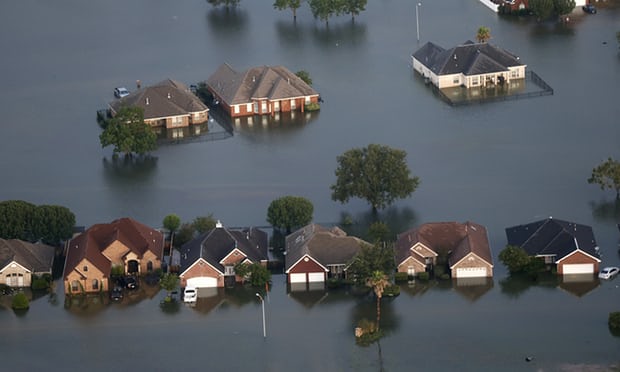 ‘The swamps and wetlands that once characterized Houston’s hinterland have been replaced with strip malls and suburban tract homes.’ Photograph: Gerald Herbert/AP