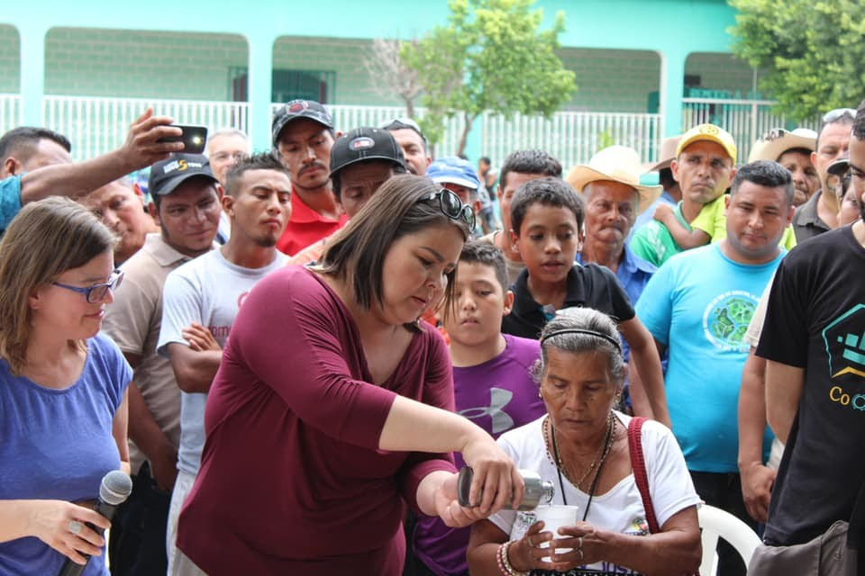 Anishinabekwe Vicki Monague presents Site 41 water to Lenca Grandmother Maria Luisa in Reitoca, Honduras. -Morgan Goertz photo