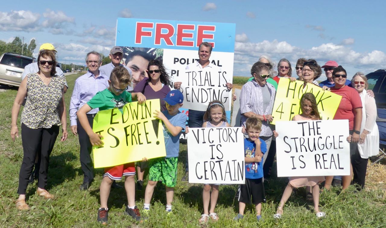 Celebration by Highway 92 in front of the political prisoners sign. -AWARE Simcoe photo